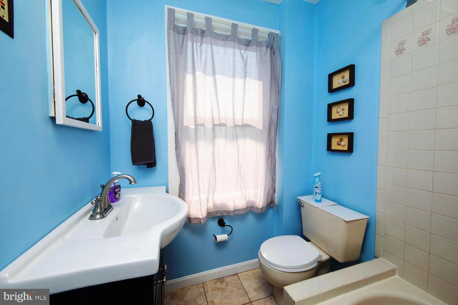 2 Township Line Road Jenkintown, PA 19027 - Photo 12 of 26 a bathroom with a toilet sink and mirror