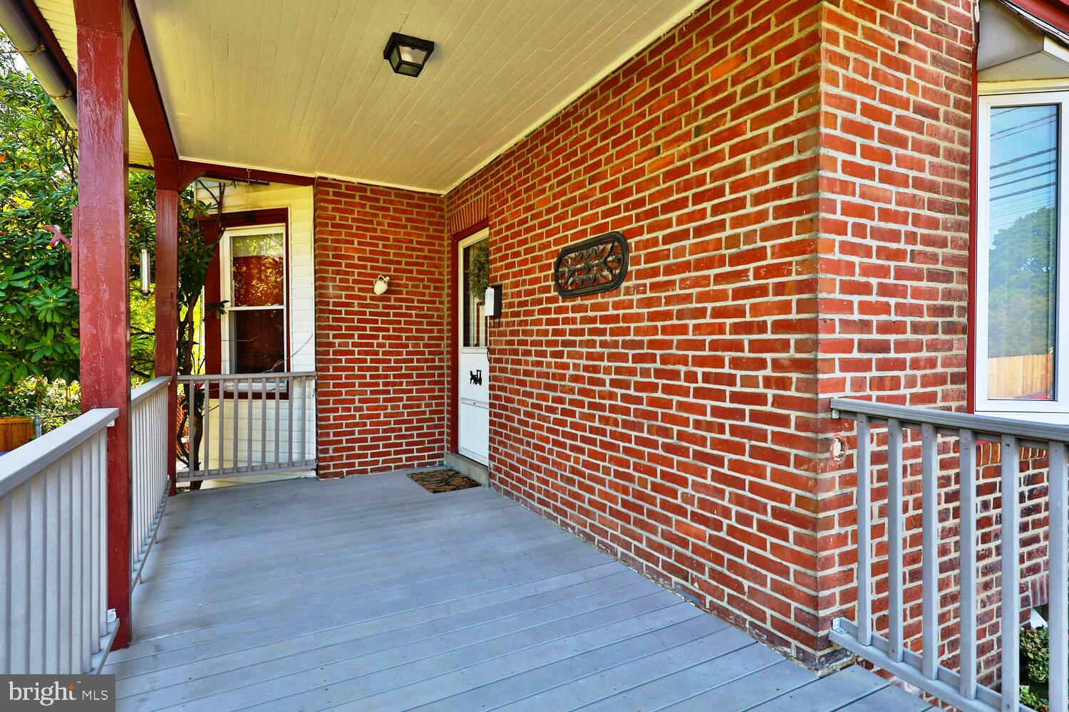 2 Township Line Road Jenkintown, PA 19027 - Photo 2 of 26 a view of a brick house with wooden fence