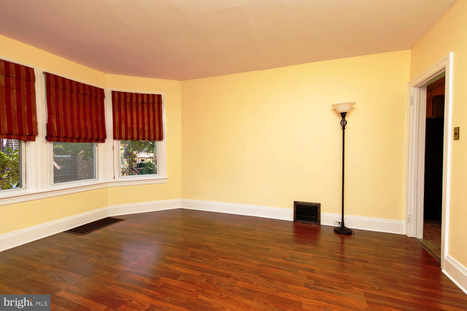 2 Township Line Road Jenkintown, PA 19027 - Photo 7 of 26 a view of an empty room with wooden floor and a window