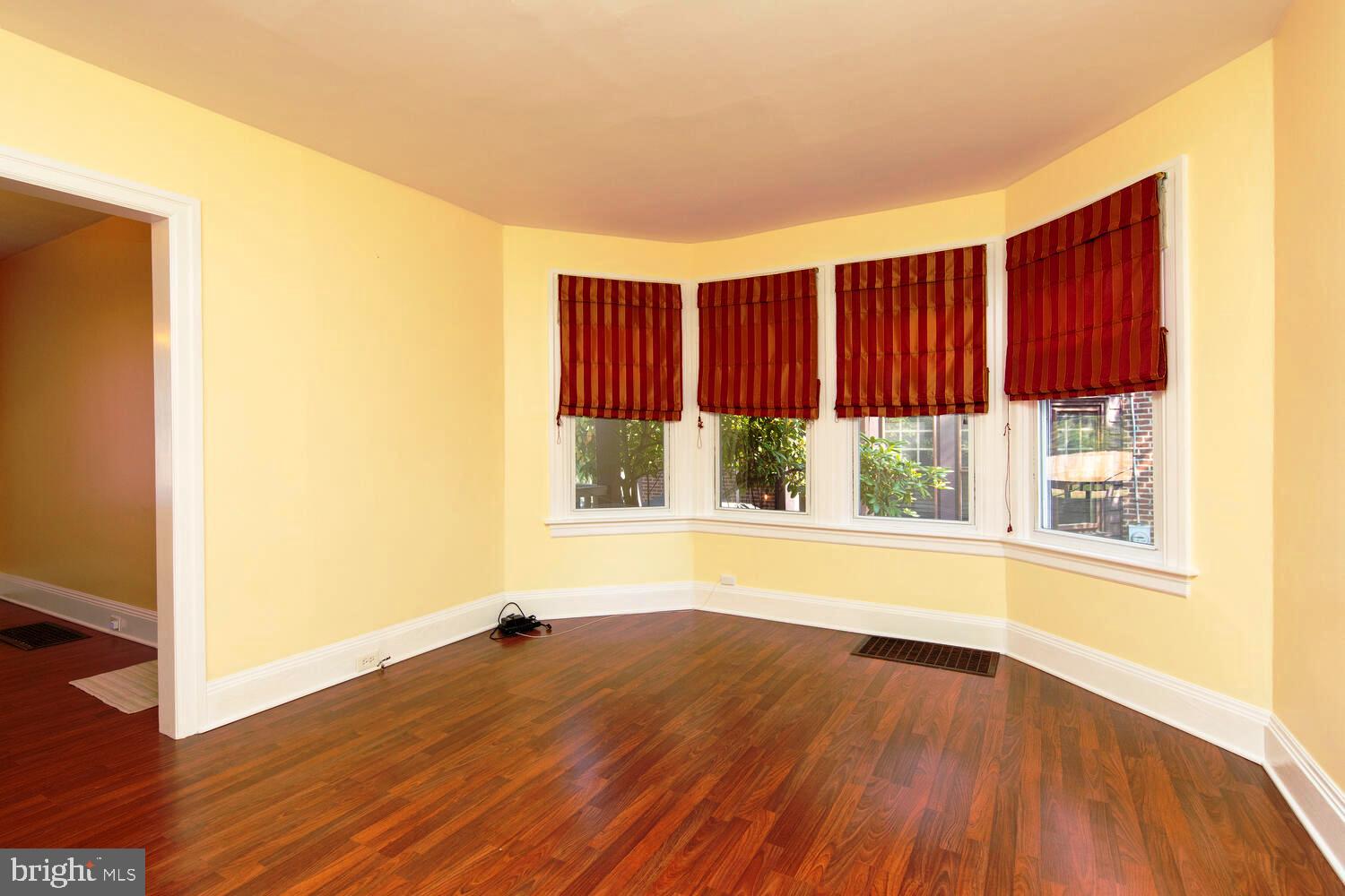 2 Township Line Road Jenkintown, PA 19027 - Photo 8 of 26 an empty room with wooden floor and windows