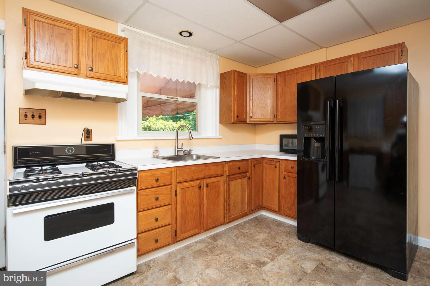 2 Township Line Road Jenkintown, PA 19027 - Photo 9 of 26 a kitchen with stainless steel appliances granite countertop a refrigerator stove and sink