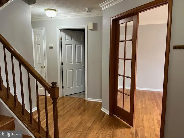 a view of an entryway with wooden floor