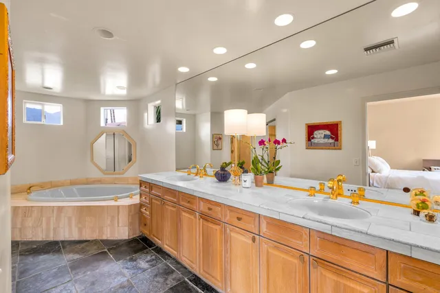 a bathroom with a sink double vanity and a mirror