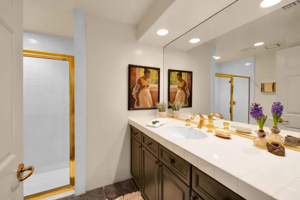 a bathroom with a sink double vanity and a mirror
