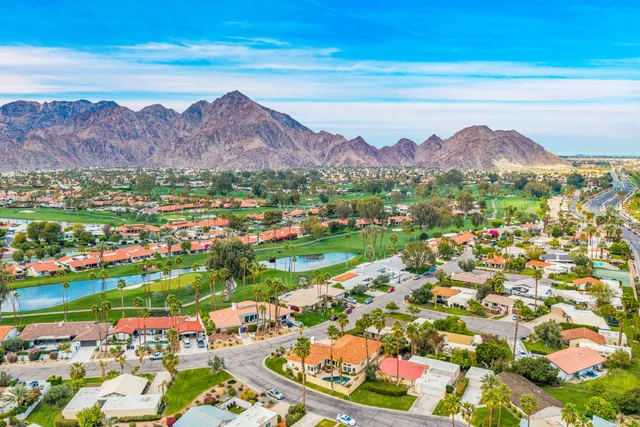 a view of a city with mountains in the background