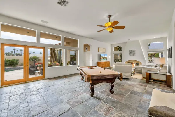 a living room with furniture a window and a table