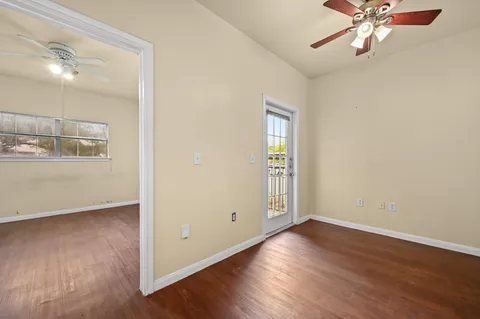 an empty room with wooden floor