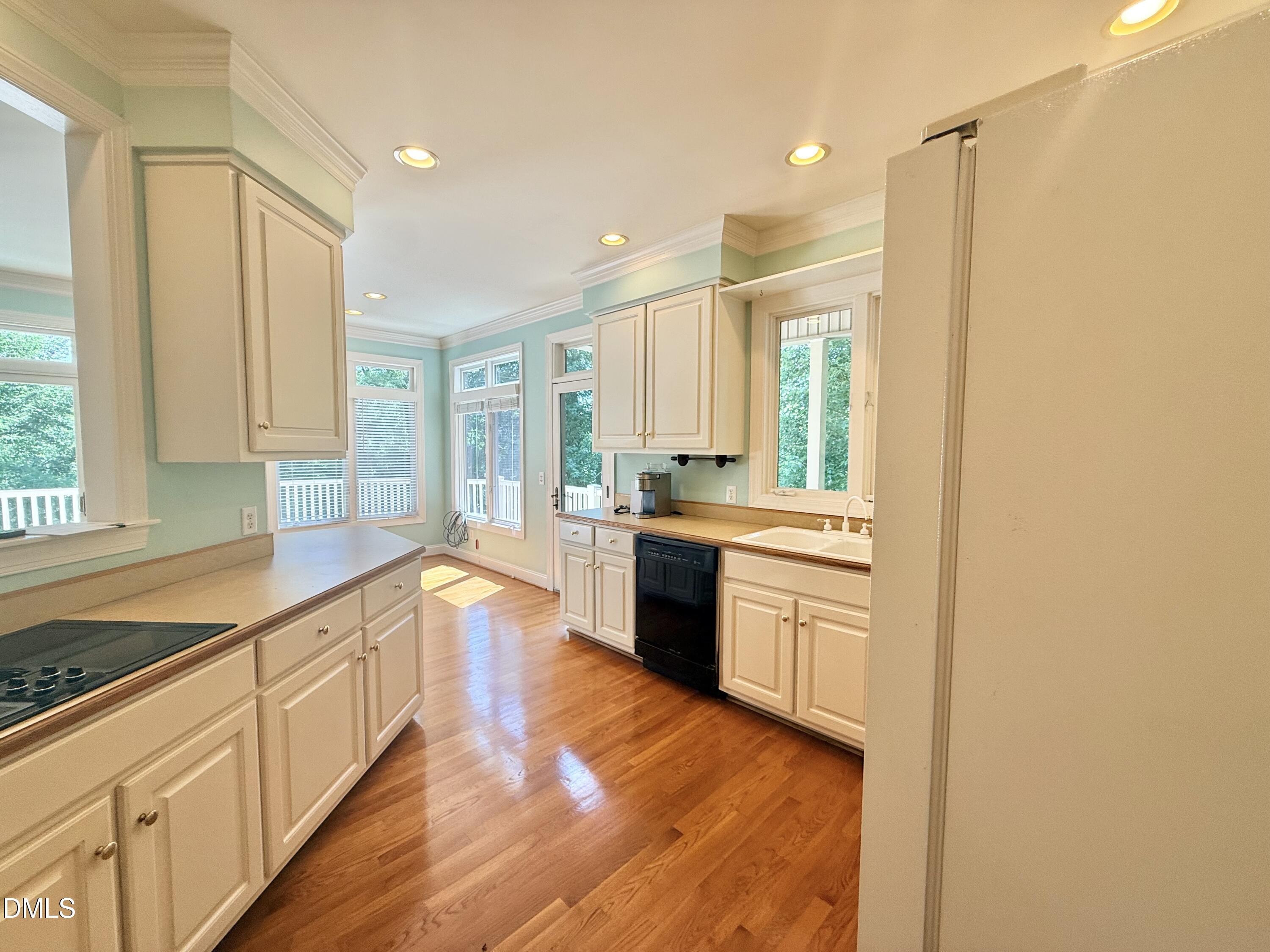 81 Beaver Crossing Road Roxboro, NC 27574 - Photo 16 of 80 a large kitchen with granite countertop a large counter top space a sink stainless steel appliances and cabinets