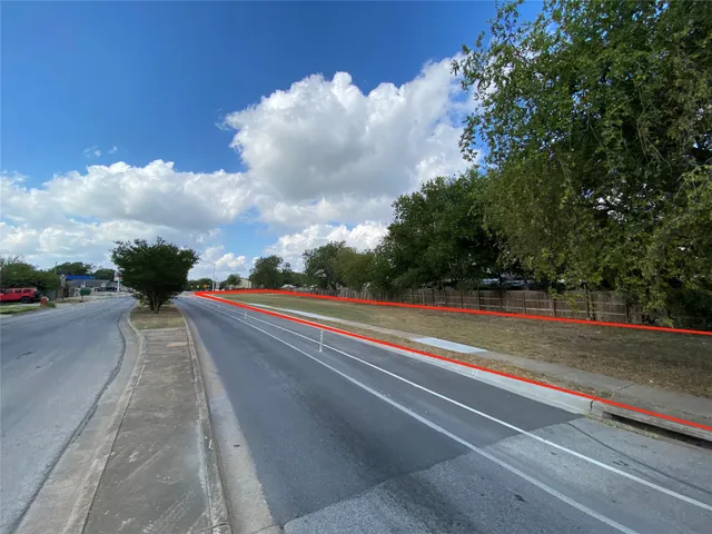 a sign board with street view