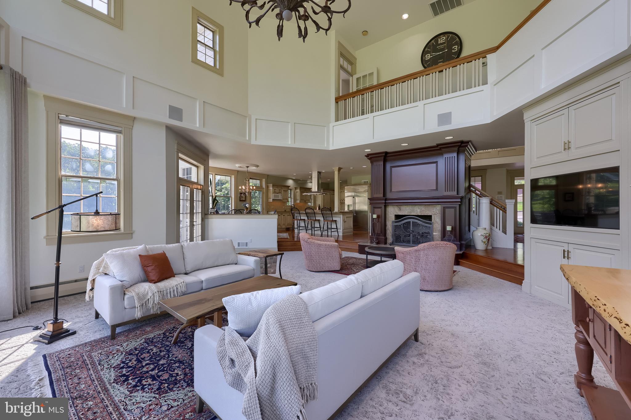 5751 Mt Pisgah Road York, PA 17406 - Photo 15 of 144 a living room with furniture a fireplace and a flat screen tv