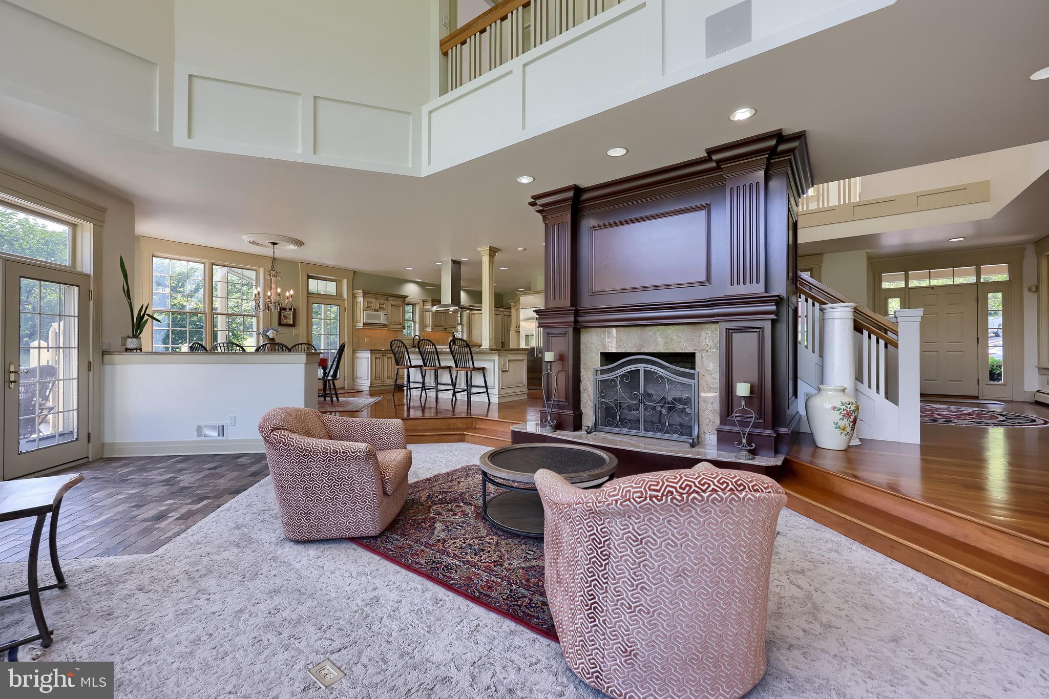 5751 Mt Pisgah Road York, PA 17406 - Photo 22 of 144 a living room with furniture a fireplace and kitchen view