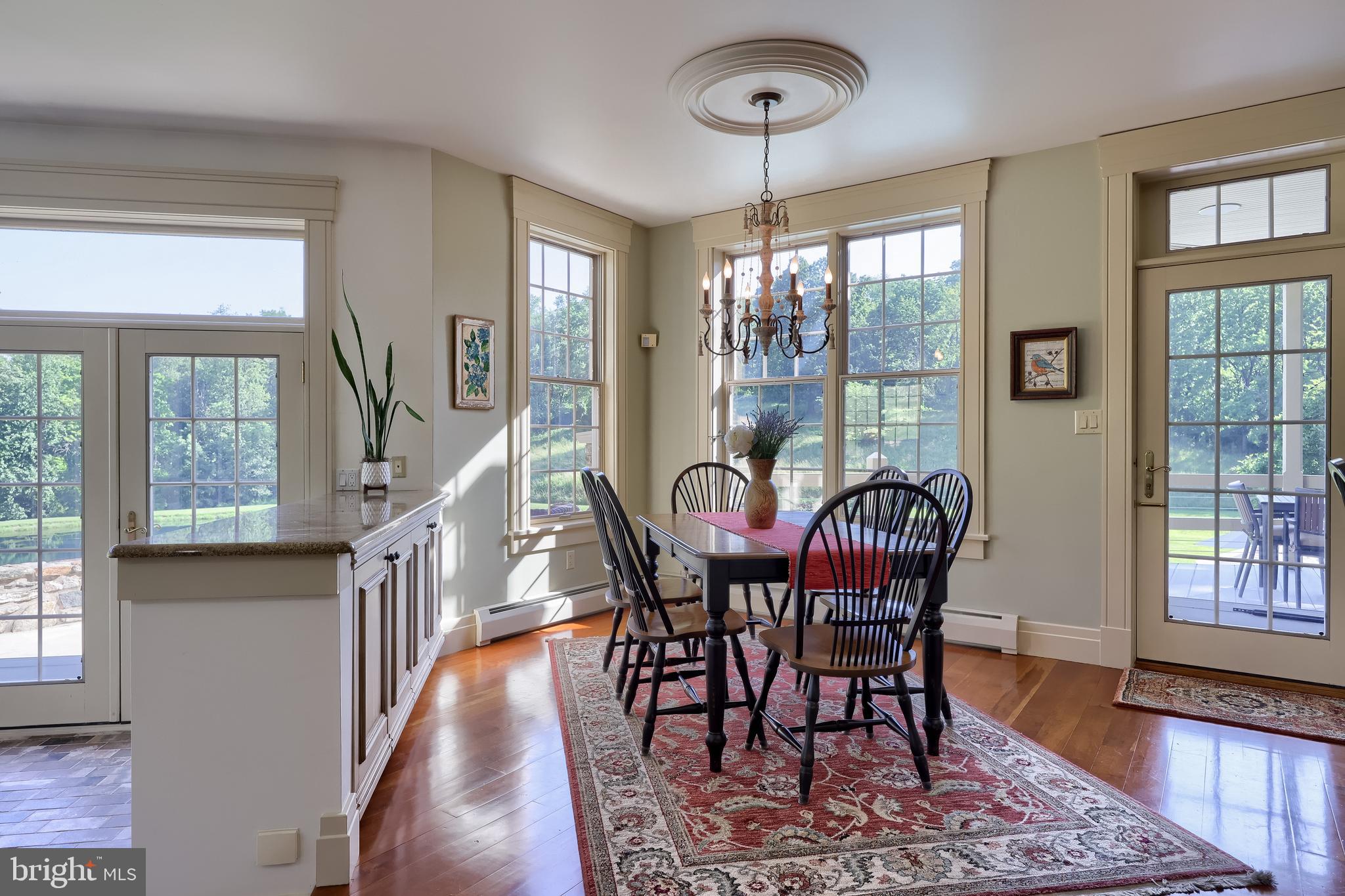 5751 Mt Pisgah Road York, PA 17406 - Photo 30 of 144 a view of a dining room with furniture window and wooden floor