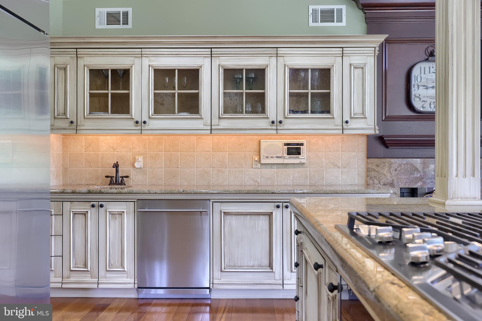 5751 Mt Pisgah Road York, PA 17406 - Photo 40 of 144 a kitchen with stainless steel appliances granite countertop a sink and a stove