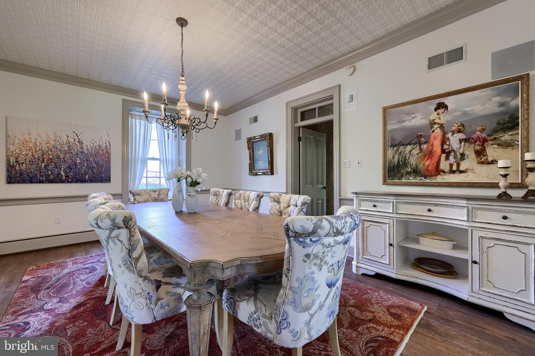 5751 Mt Pisgah Road York, PA 17406 - Photo 44 of 144 a view of a dining room with furniture a chandelier and wooden floor