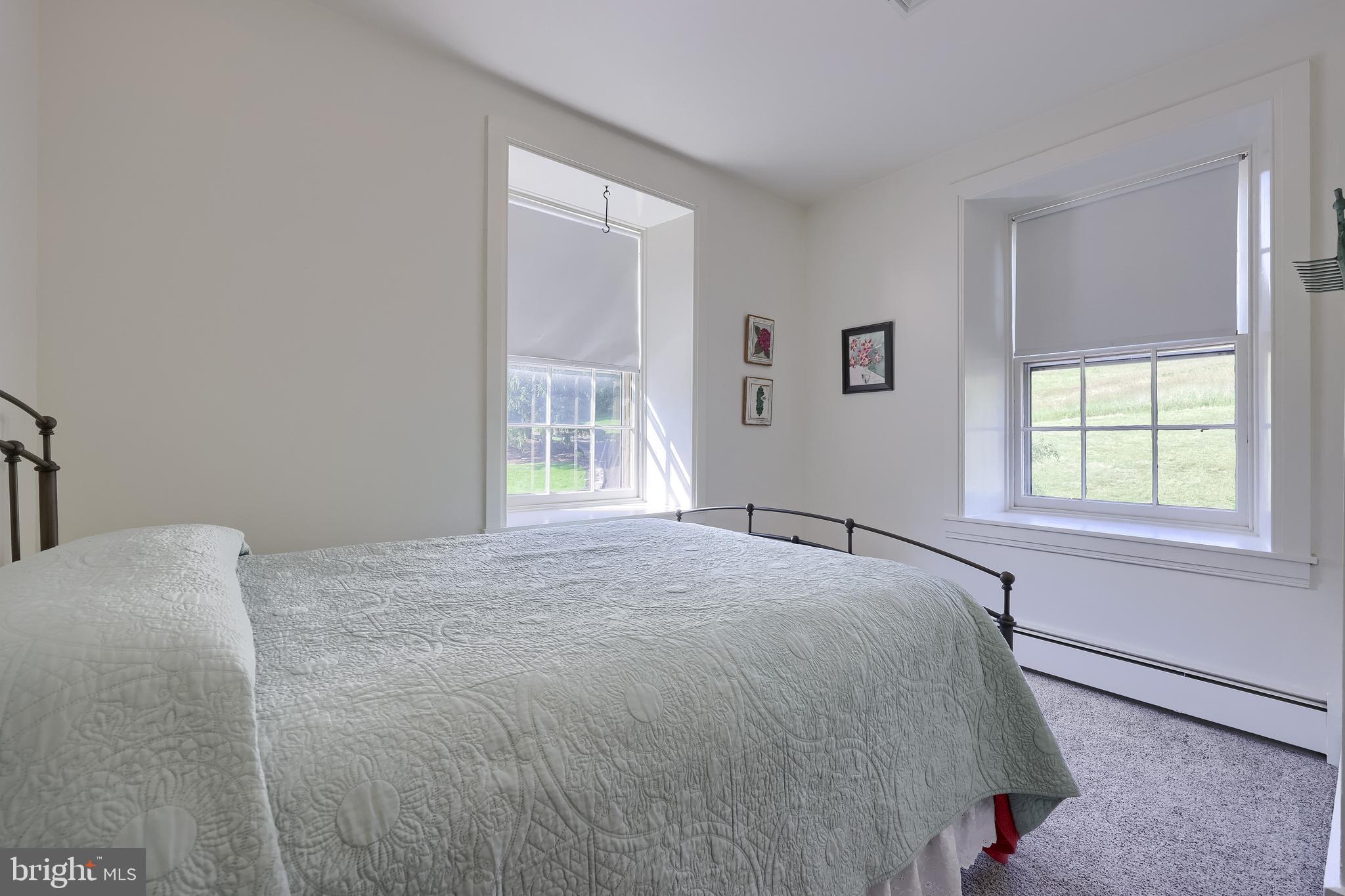 5751 Mt Pisgah Road York, PA 17406 - Photo 69 of 144 a bed sitting in a bedroom next to a window