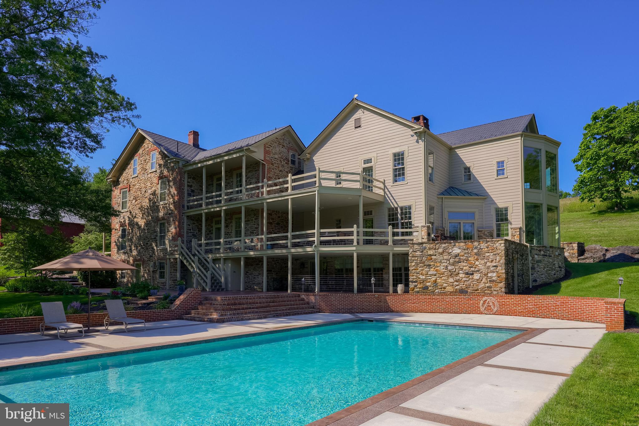 5751 Mt Pisgah Road York, PA 17406 - Photo 99 of 144 a front view of a house with a yard table and chairs