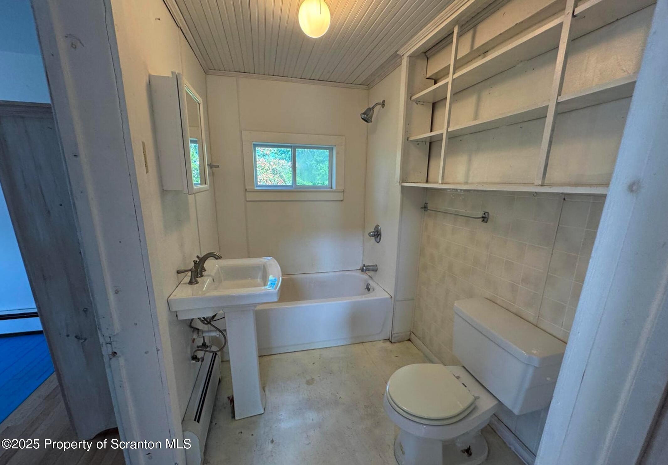394 Dennis Road Honesdale, PA 18431 - Photo 11 of 13 a bathroom with a sink a toilet and shower