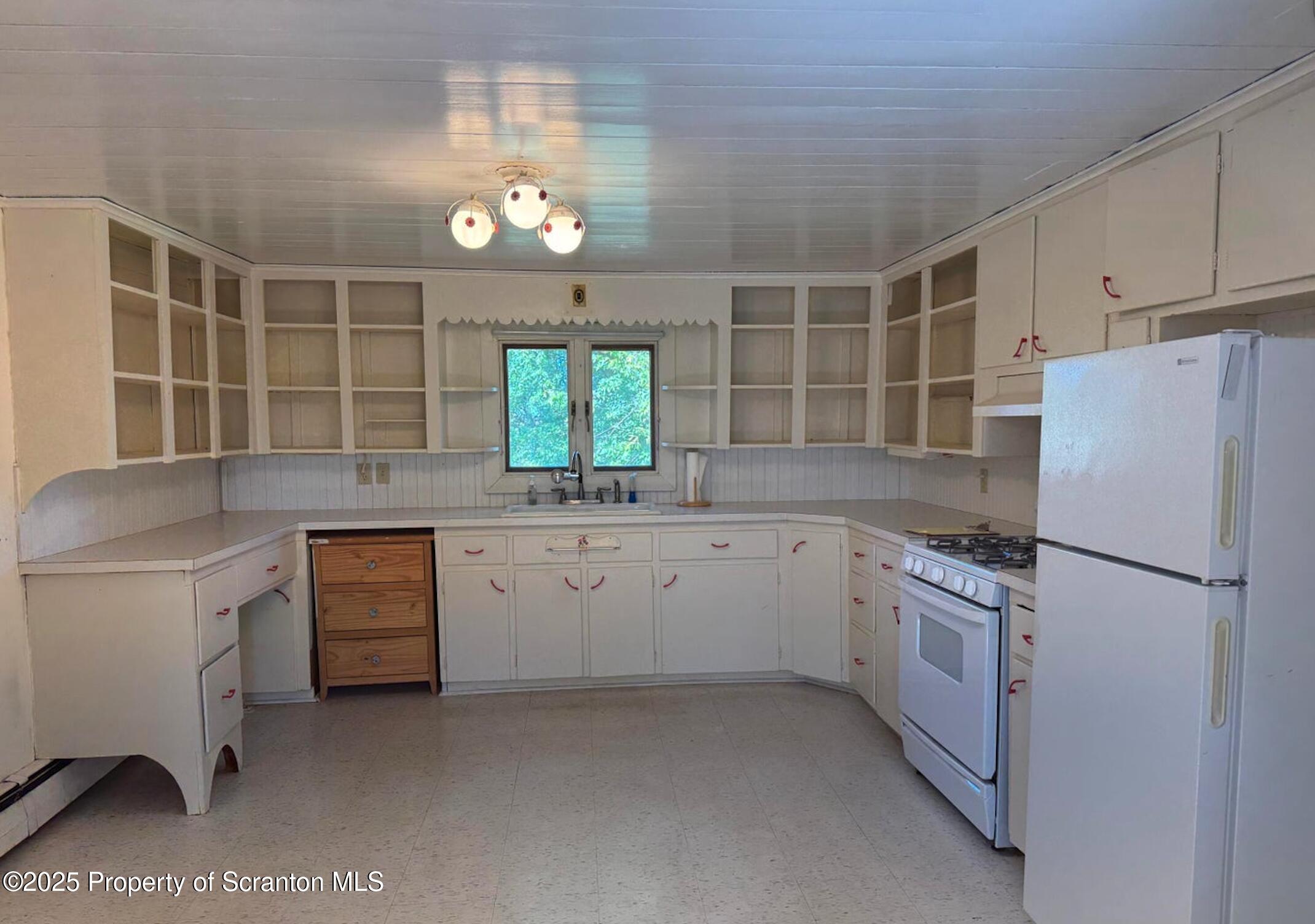 394 Dennis Road Honesdale, PA 18431 - Photo 5 of 13 a kitchen with granite countertop a sink stainless steel appliances and cabinets