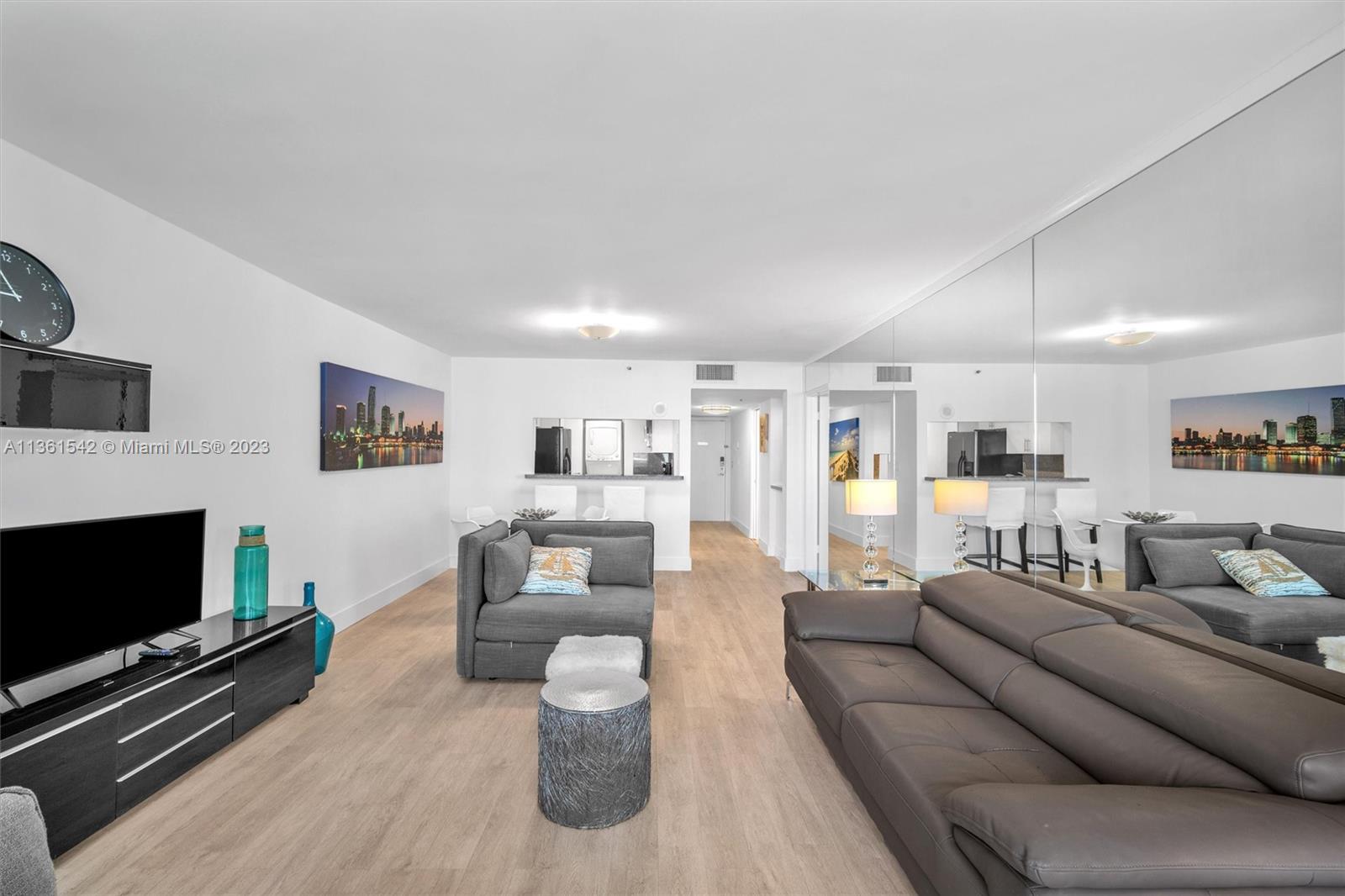 Omni Miami, FL 33132 - Photo 11 of 22 a living room with furniture and a flat screen tv