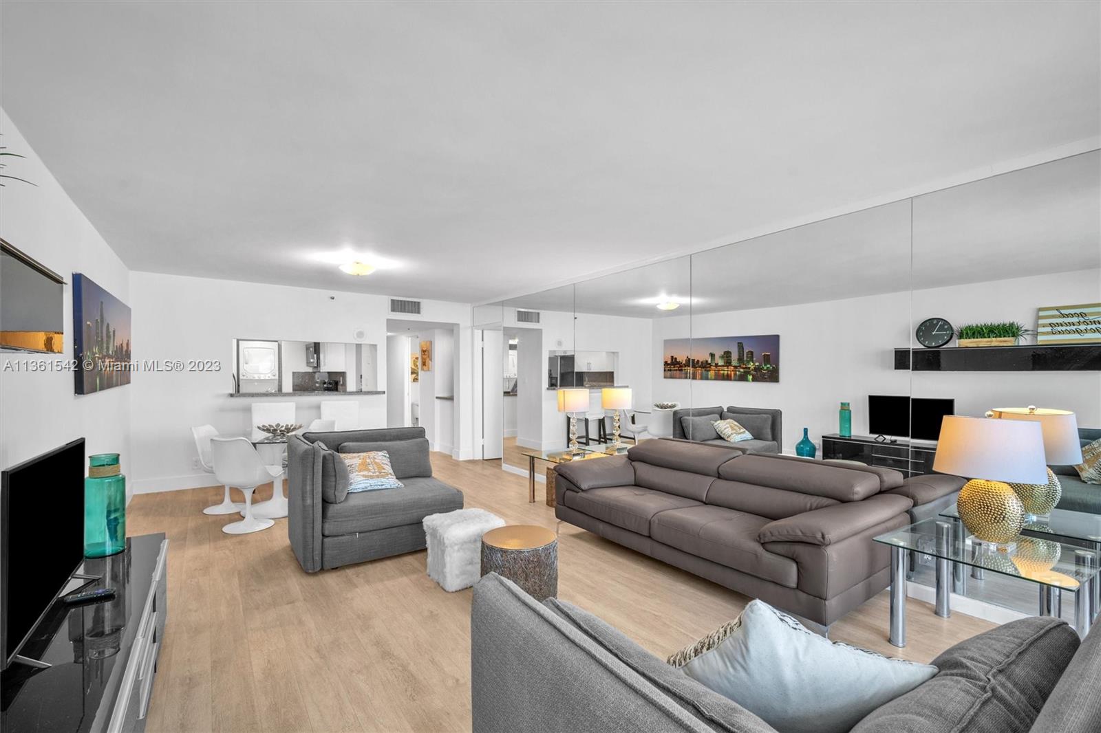 Omni Miami, FL 33132 - Photo 13 of 22 a living room with furniture and a flat screen tv