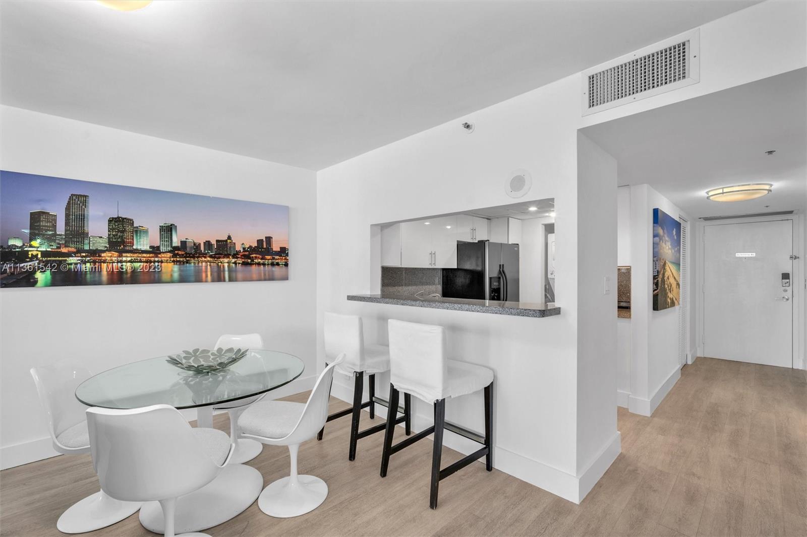 Omni Miami, FL 33132 - Photo 14 of 22 a living room with furniture and a dining table with kitchen view