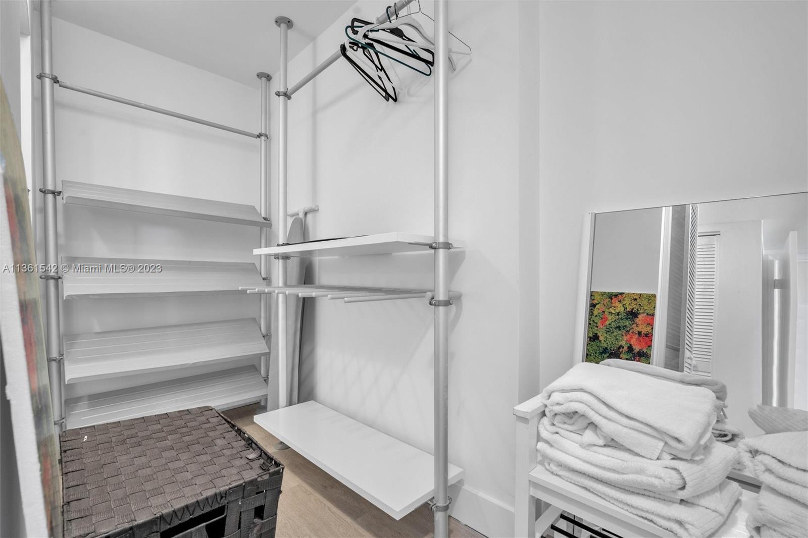 Omni Miami, FL 33132 - Photo 19 of 22 a bedroom with a bed and a dresser