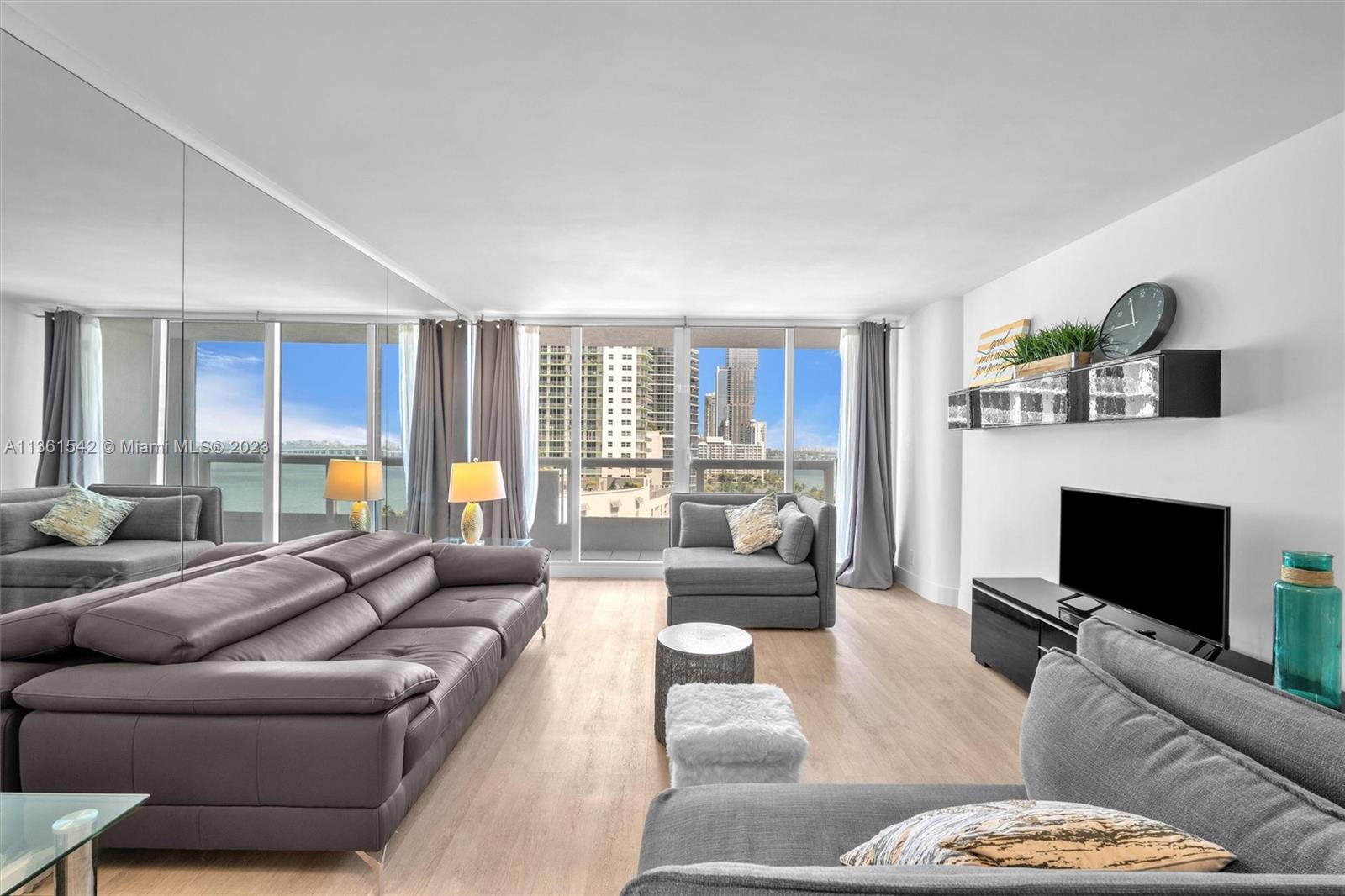 Omni Miami, FL 33132 - Photo 9 of 22 a living room with furniture and a fireplace