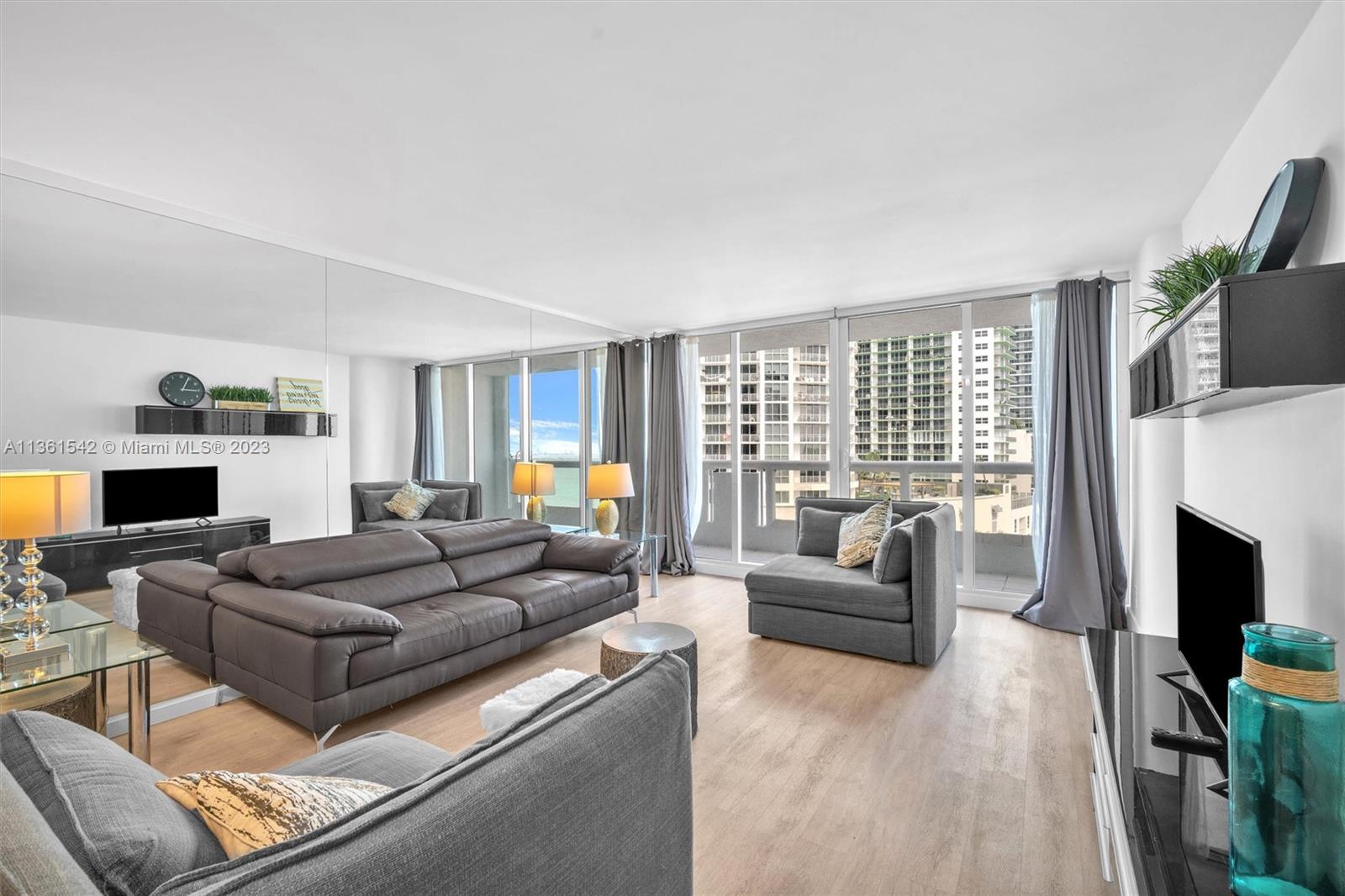 Omni Miami, FL 33132 - Photo 10 of 22 a living room with furniture and a fireplace