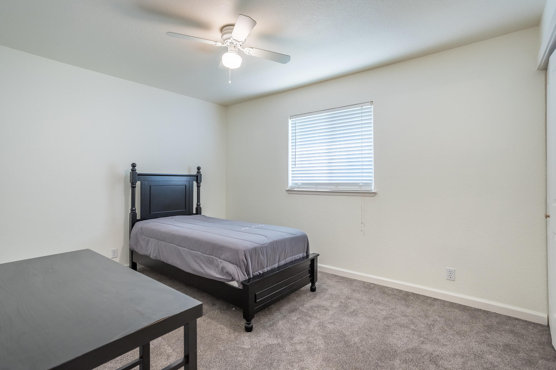 1102 Hope Lane Redding, CA 96003 - Photo 18 of 29 a bedroom with two beds and a window