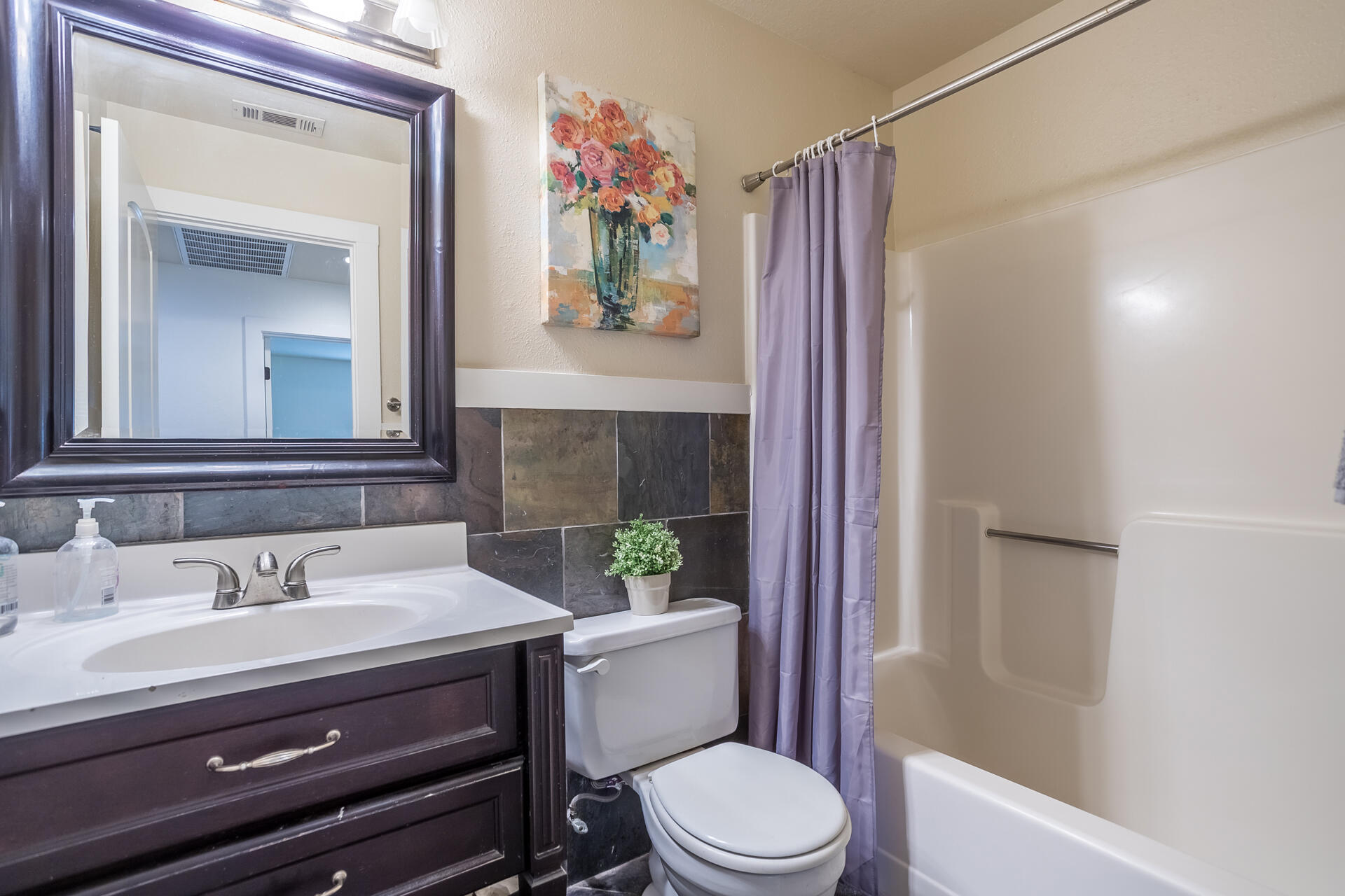 1102 Hope Lane Redding, CA 96003 - Photo 20 of 29 a bathroom with a sink a toilet and shower curtain