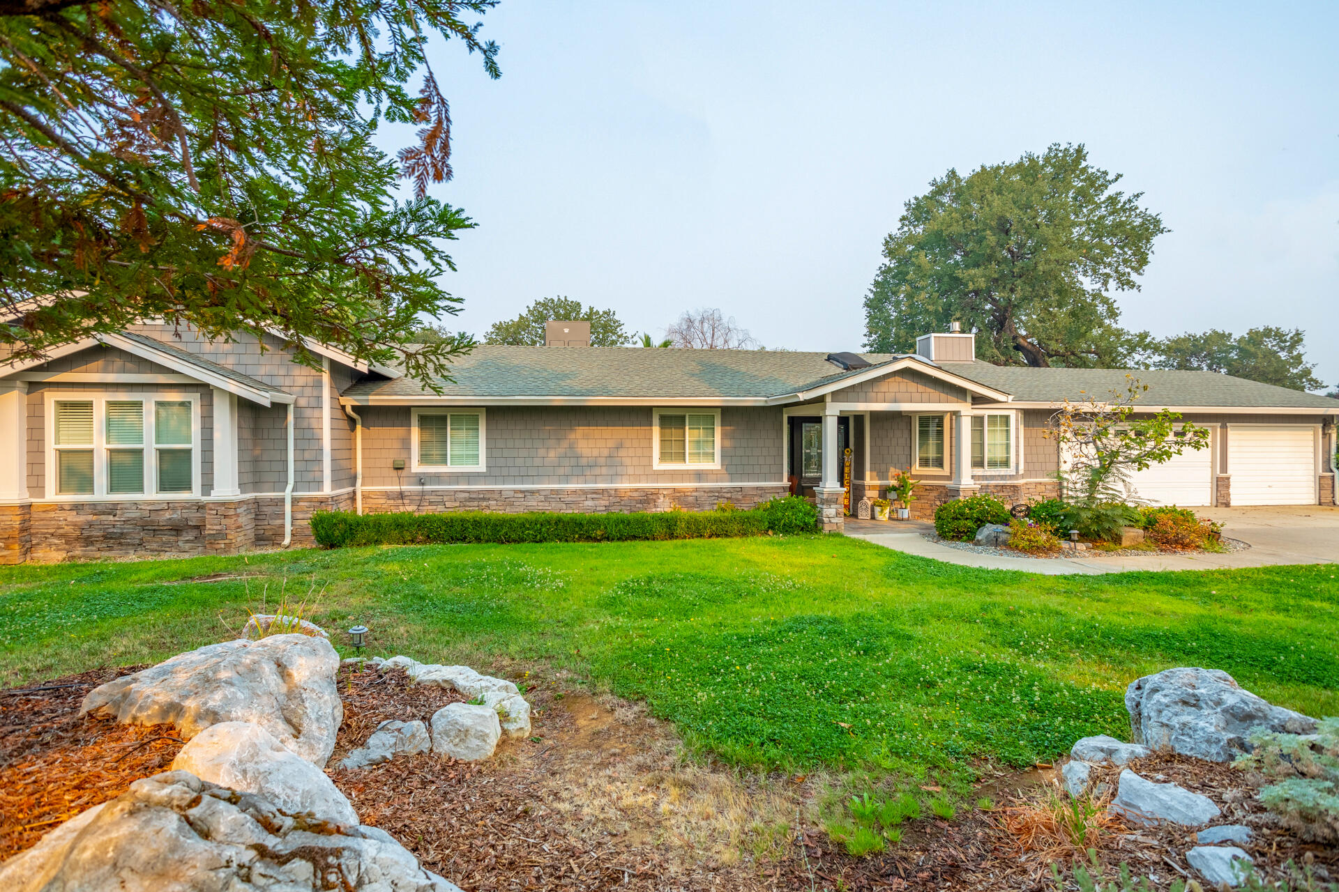 1102 Hope Lane Redding, CA 96003 - Photo 2 of 29 a front view of a house with garden