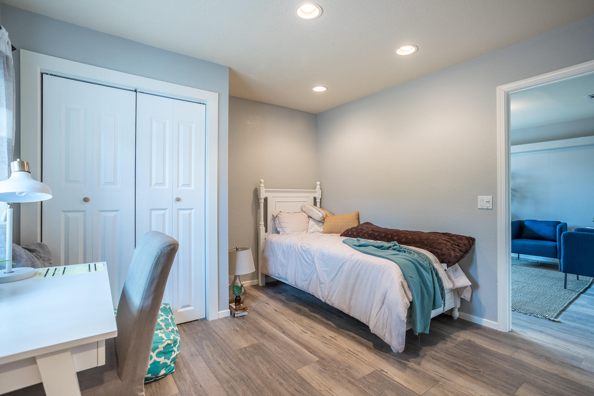 1102 Hope Lane Redding, CA 96003 - Photo 21 of 29 a bedroom with a bed a chair and the dresser in it
