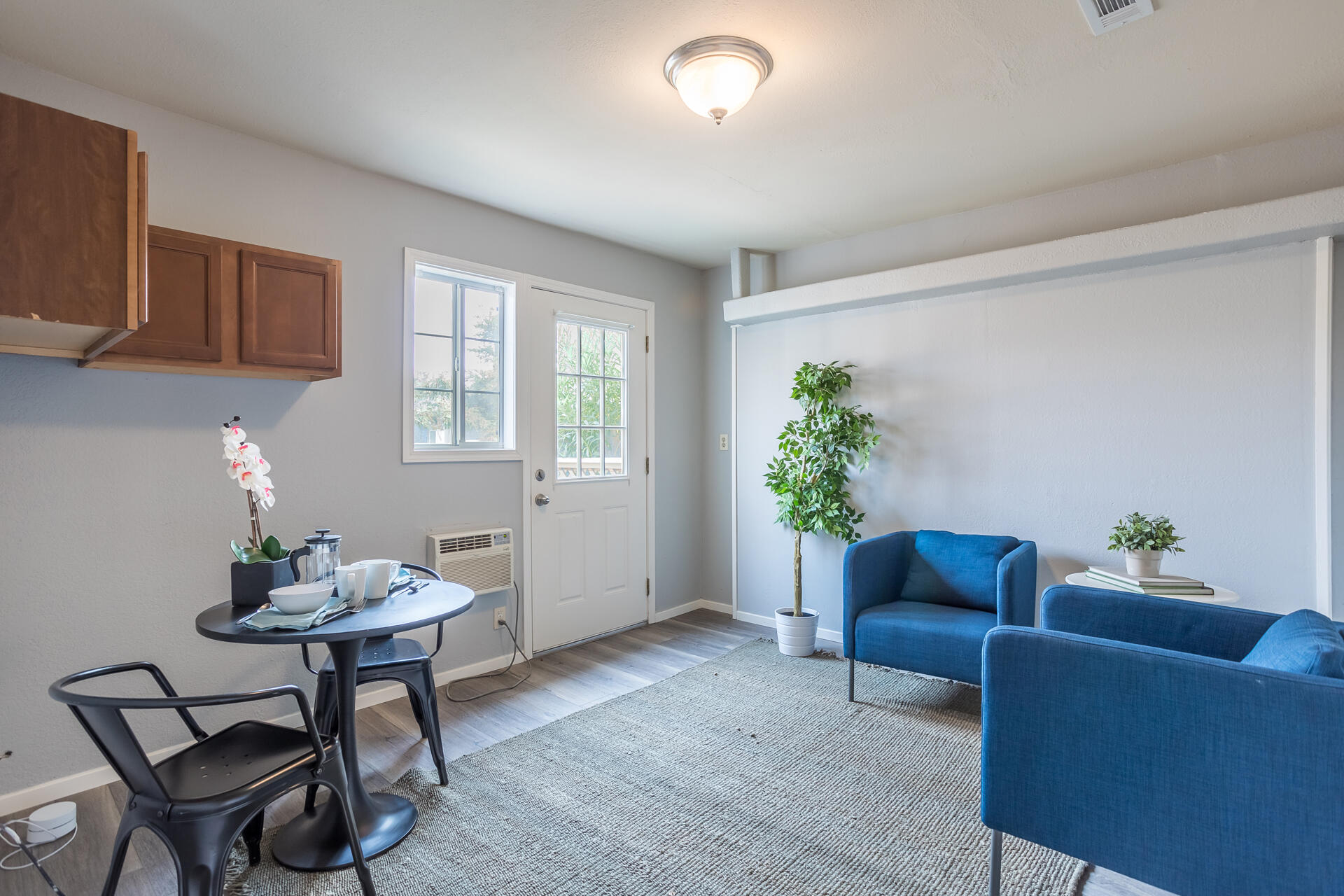1102 Hope Lane Redding, CA 96003 - Photo 22 of 29 a living room with furniture and a potted plant