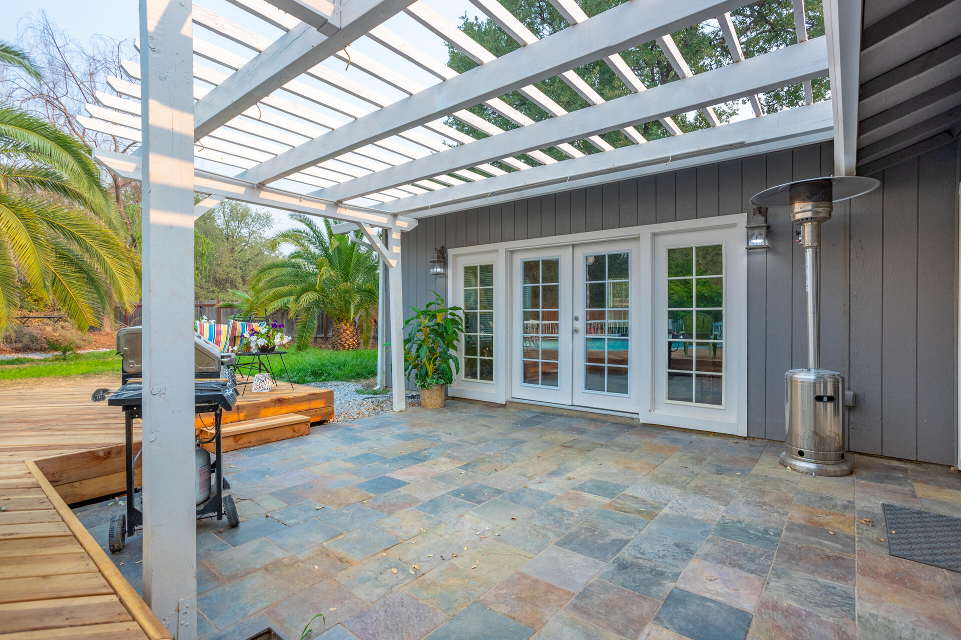 1102 Hope Lane Redding, CA 96003 - Photo 23 of 29 a view of a building with porch and outdoor seating