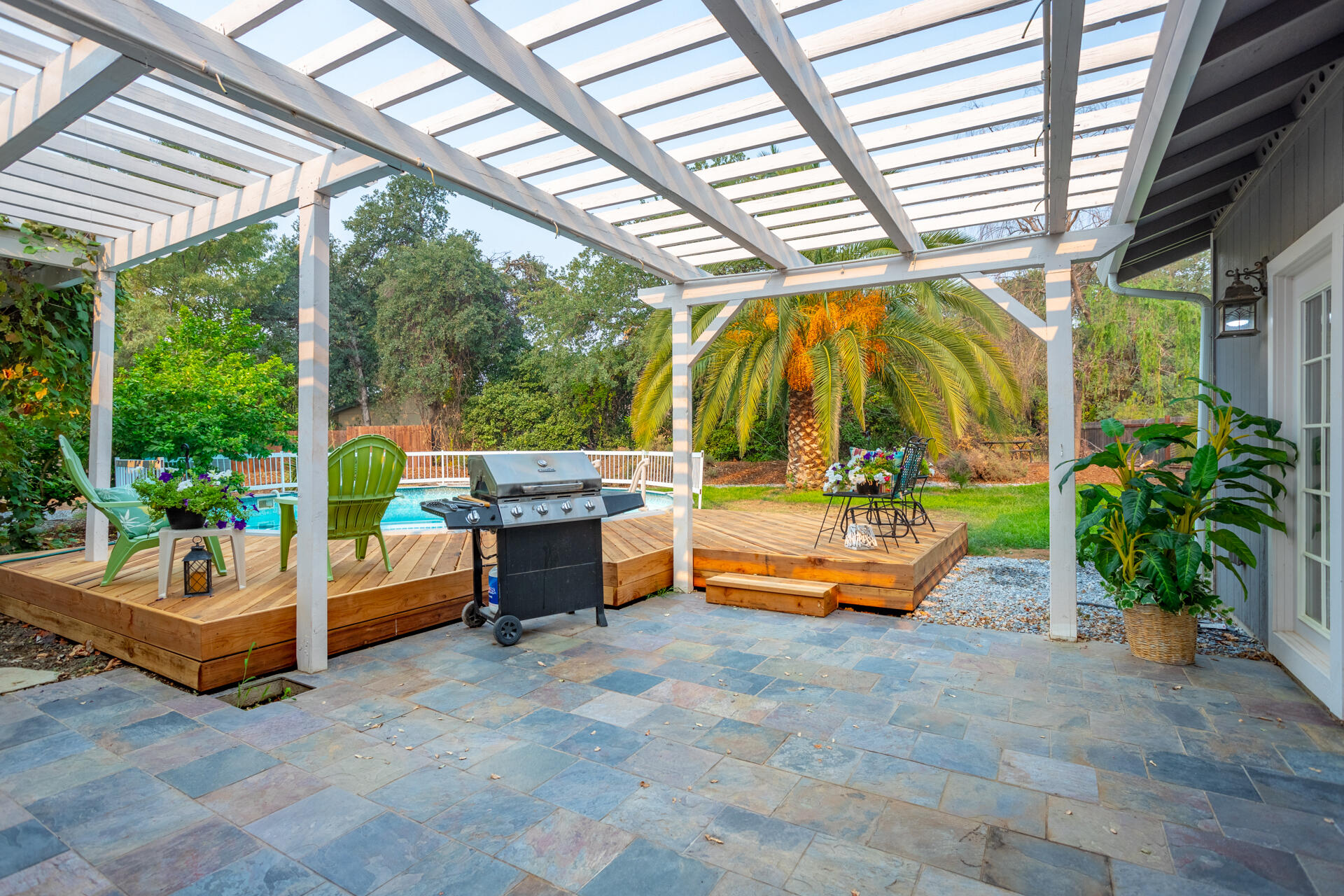 1102 Hope Lane Redding, CA 96003 - Photo 24 of 29 a backyard of a house with outdoor seating