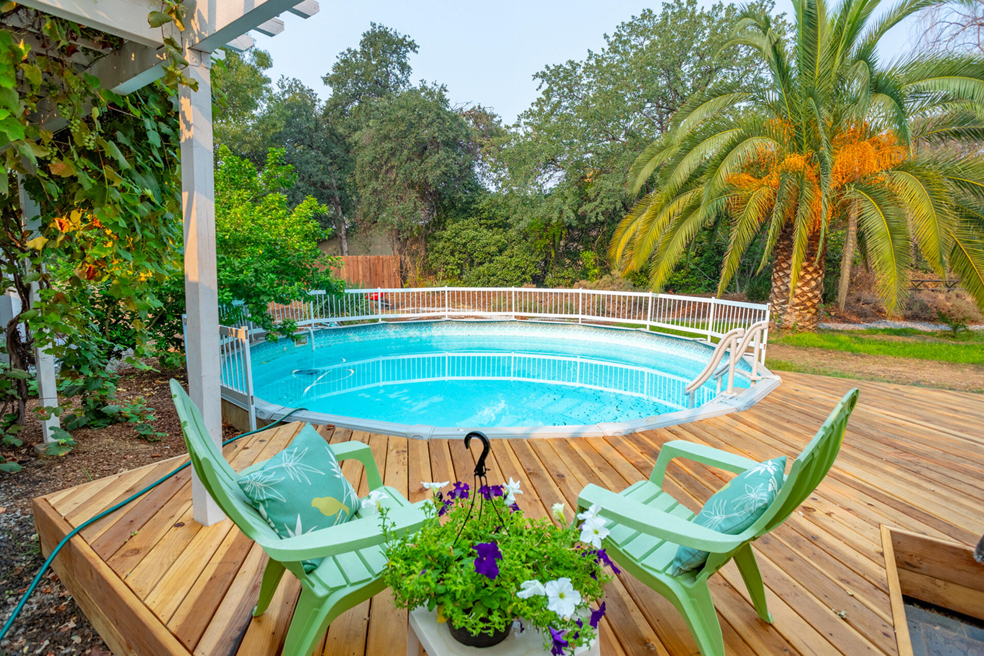 1102 Hope Lane Redding, CA 96003 - Photo 25 of 29 a view of a swimming pool with a patio and a garden