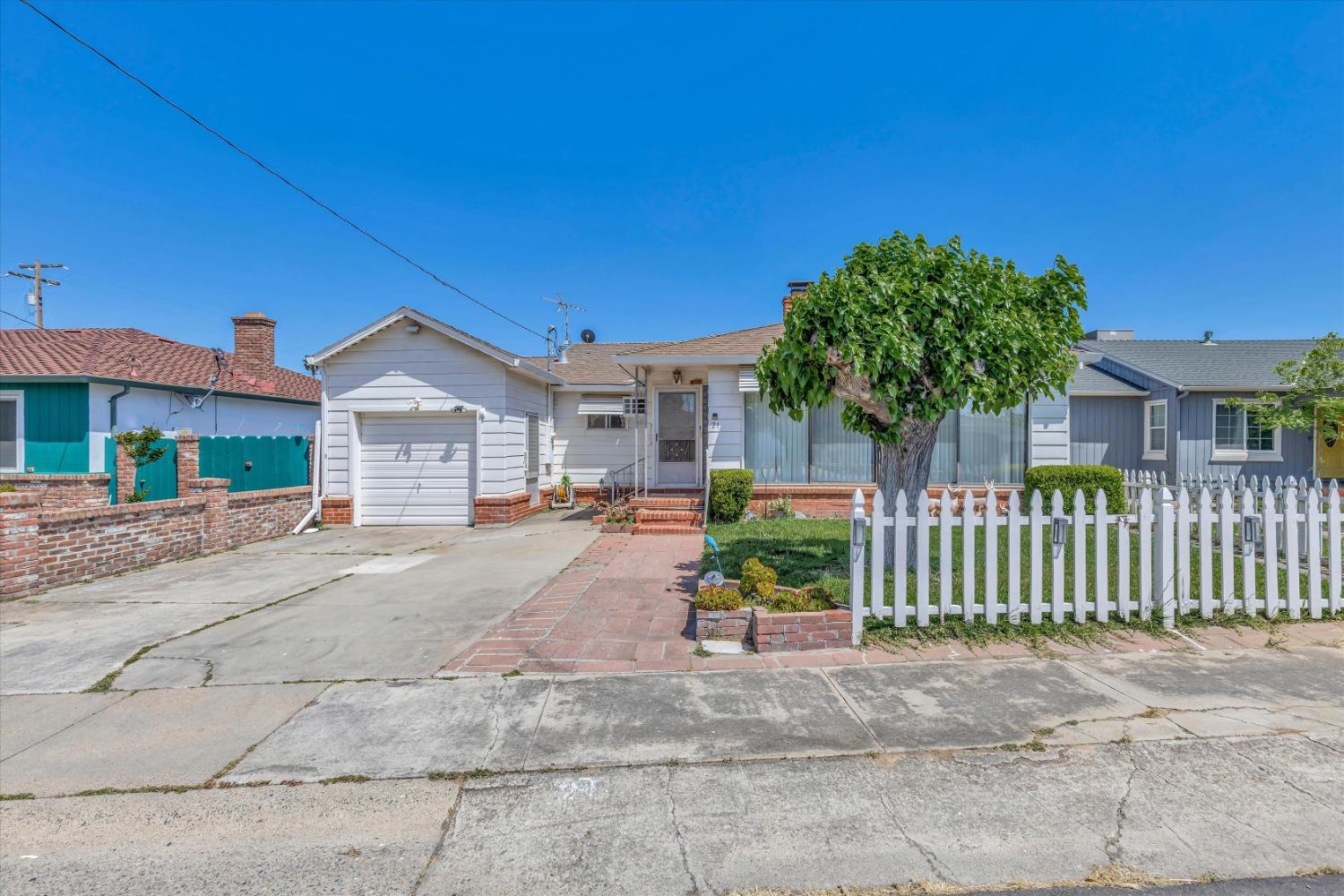 21 4th Avenue Isleton, CA 95641 - Photo 1 of 1 a front view of a house with a garden