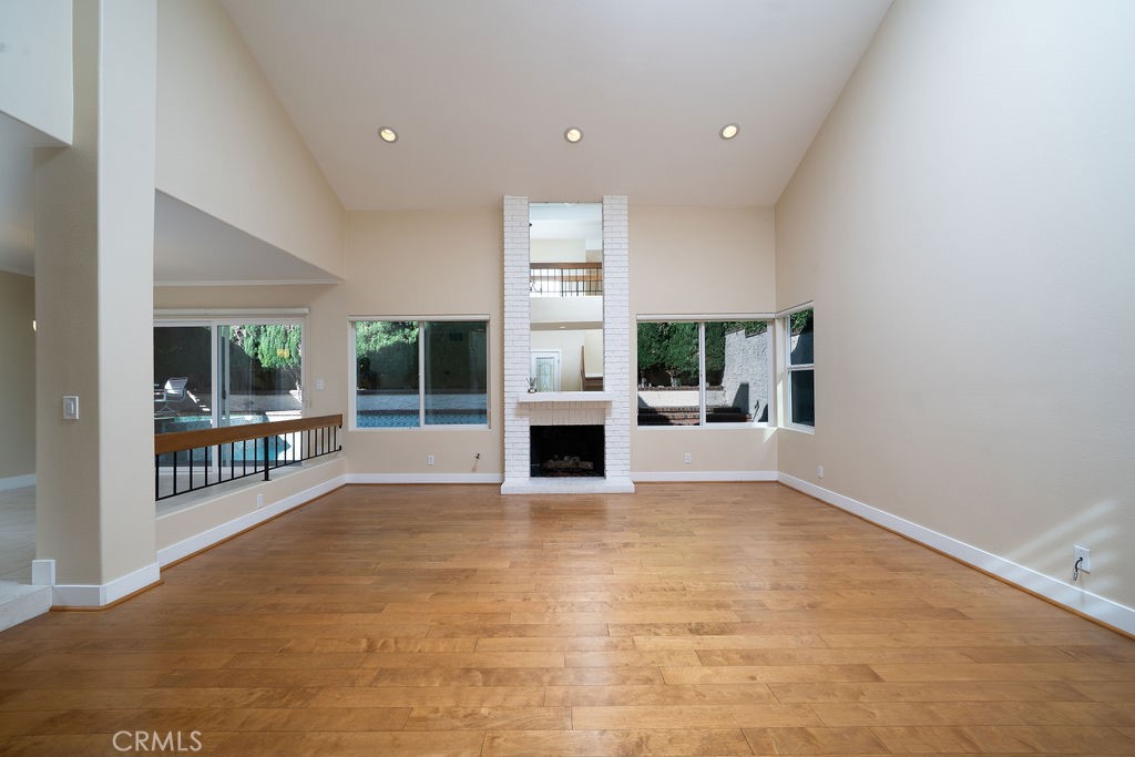 34 Columbus Irvine, CA 92620 - Photo 5 of 33 a view of an empty room with a fireplace and a window