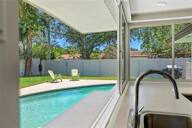 a backyard view with a seating space