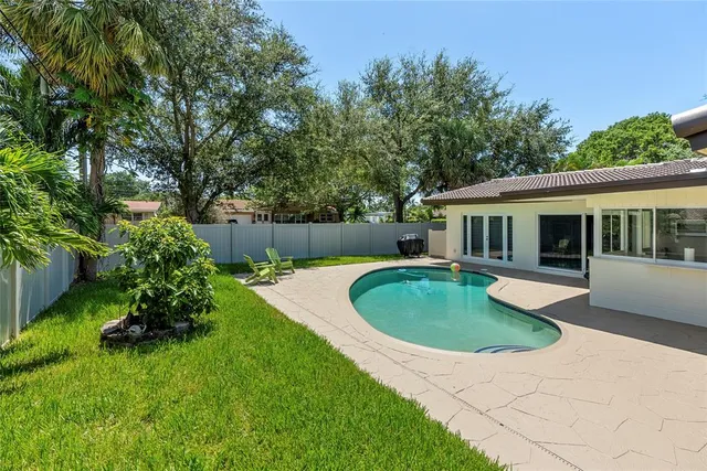a view of a house with a swimming pool