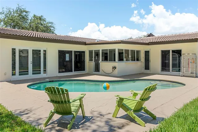 a front view of a house with swimming pool