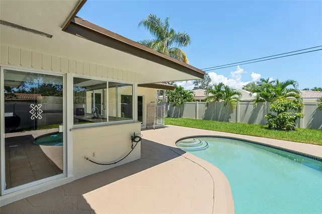 a view of a house with a garden and plants