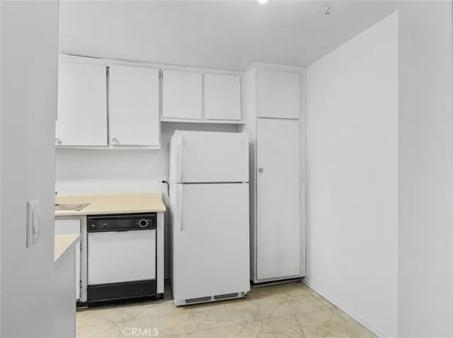 a view of a hallway with a room