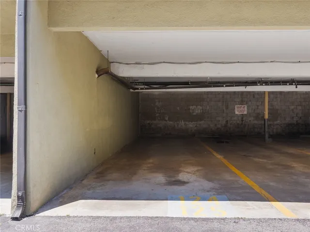 a view of a patio with a table and chairs under an umbrella