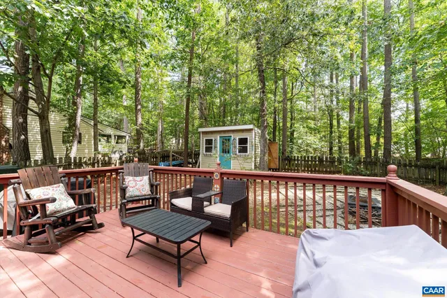a view of a chair and tables in the balcony
