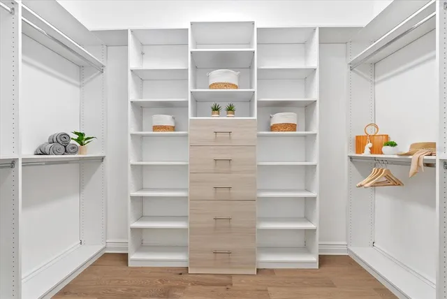 a view of an empty walk in closet