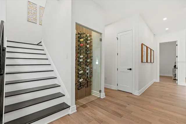 a view of entryway with stairs and wooden floor