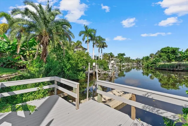 a view of a wooden deck and a yard