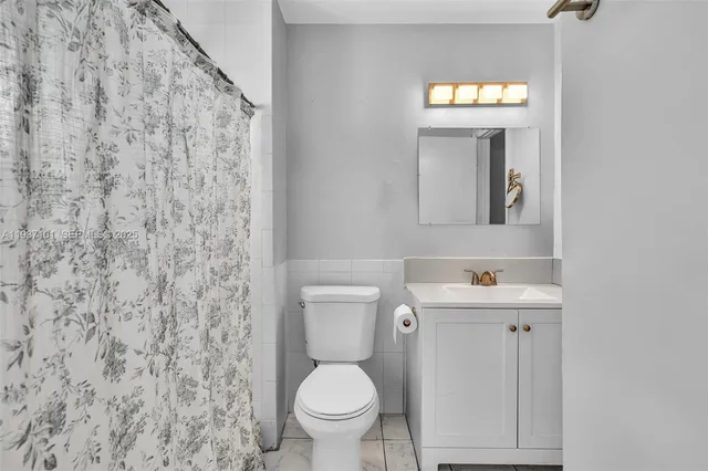 a view of a backyard with chairs and a patio