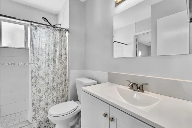 a view of a chair and table in the patio